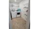 Clean laundry room with shelving and washer/dryer hookups at 129 Carolyn Path, Rockmart, GA 30153