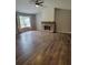 Spacious living room with a stone fireplace and natural light at 129 Carolyn Path, Rockmart, GA 30153