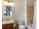 Full bathroom with a well-maintained vanity, toilet, and a tiled shower/tub combination at 2469 Silver King Dr, Grayson, GA 30017