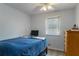 Inviting bedroom with a cozy bed and wooden dresser, complemented by a window view at 2469 Silver King Dr, Grayson, GA 30017
