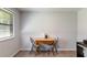 Cozy dining area with a table and two chairs next to a window, perfect for intimate meals at 2469 Silver King Dr, Grayson, GA 30017