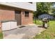 Backyard patio with a grill, storage, and a door leading into the house at 2469 Silver King Dr, Grayson, GA 30017
