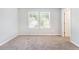 Empty bedroom with neutral walls, carpet, and natural light from two windows at 2769 Morgan Spring Trl, Buford, GA 30519
