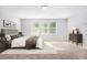 Primary bedroom with neutral walls, carpet and a set of windows, creating a calm atmosphere at 2769 Morgan Spring Trl, Buford, GA 30519