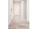 Bright entryway featuring modern wood-look flooring and a classic white front door at 2769 Morgan Spring Trl, Buford, GA 30519
