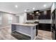 Bright kitchen with stainless steel appliances, granite countertops and a large center island with a sink at 2769 Morgan Spring Trl, Buford, GA 30519