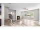 Spacious living room with a cozy fireplace, staircase and modern vinyl floors at 2769 Morgan Spring Trl, Buford, GA 30519
