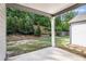 Spacious patio area leads to a grassy yard with mature trees and landscaping providing a private outdoor space at 2769 Morgan Spring Trl, Buford, GA 30519
