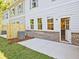 New construction townhouse with a fenced backyard and concrete patio space at 4663 Larkfield Way, Powder Springs, GA 30127