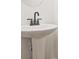 Clean pedestal sink and faucet in a bathroom at 4663 Larkfield Way, Powder Springs, GA 30127
