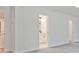 A bedroom entrance featuring a bathroom with a double sink and a walk in closet at 4663 Larkfield Way, Powder Springs, GA 30127