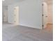 Spacious bedroom with plush carpeting, walk-in closet, and ample natural light at 4663 Larkfield Way, Powder Springs, GA 30127