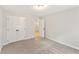 Neutral-colored bedroom featuring carpet floors and a double-door closet at 4663 Larkfield Way, Powder Springs, GA 30127