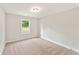 Carpeted bedroom with a single window at 4663 Larkfield Way, Powder Springs, GA 30127