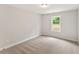 Bedroom with neutral carpet and a view from the window at 4663 Larkfield Way, Powder Springs, GA 30127