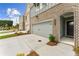 Beautiful townhome exterior showcasing a well-maintained lawn and attached two car garage at 4663 Larkfield Way, Powder Springs, GA 30127