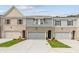 Charming townhomes featuring modern exteriors, attached garages, and manicured landscaping at 4663 Larkfield Way, Powder Springs, GA 30127