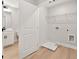 Laundry room with vinyl floors, washer and dryer hookups, and a wire rack shelf at 4663 Larkfield Way, Powder Springs, GA 30127