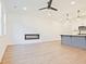 Bright living room featuring wood floors, a modern fireplace, recessed lighting, and an open layout at 4663 Larkfield Way, Powder Springs, GA 30127