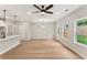 Light-filled living room features hardwood floors, recessed lighting, and an open floor plan at 4663 Larkfield Way, Powder Springs, GA 30127
