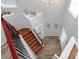 Open foyer with hardwood floors, wrought iron staircase, high ceilings, and decorative accents at 5645 Carrington Pl, Cumming, GA 30040