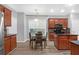 Charming eat-in kitchen with wood cabinets, granite counters, and stainless steel appliances at 5645 Carrington Pl, Cumming, GA 30040