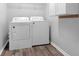Efficient laundry room featuring a washer and dryer, making laundry chores a breeze at 5645 Carrington Pl, Cumming, GA 30040