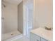 Bathroom featuring a modern shower, vanity and fixtures and recently tiled floors at 971 Sims Nw Ave, Atlanta, GA 30318