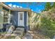 Cozy home featuring a white entry door with steps, cool tone siding, and an efficient AC unit at 971 Sims Nw Ave, Atlanta, GA 30318