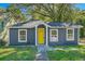 Charming exterior of the house featuring a freshly painted door and well-maintained front yard at 971 Sims Nw Ave, Atlanta, GA 30318