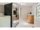 Functional kitchen features stainless steel appliances, and ample counter space with laundry at 971 Sims Nw Ave, Atlanta, GA 30318