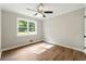 Comfortable bedroom features hardwood floors, a window for natural light, and neutral walls for a relaxing ambiance at 2125 Lynn Sw Dr, Marietta, GA 30060