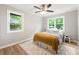 Inviting bedroom features hardwood floors, natural lighting, and neutral walls, creating a serene retreat at 2125 Lynn Sw Dr, Marietta, GA 30060