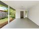 View of covered patio with brick wall and grey painted concrete floor at 2125 Lynn Sw Dr, Marietta, GA 30060