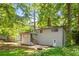 The backyard shows a wooden deck, walk out basement and stairs leading up to the main level at 271 Leafwood Ln, Riverdale, GA 30274