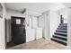 Basement laundry area with washer, dryer, refrigerator, and stairs to another level of the home at 271 Leafwood Ln, Riverdale, GA 30274