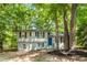 Charming split-level home with freshly painted brick, new landscaping, and a bright blue front door at 271 Leafwood Ln, Riverdale, GA 30274