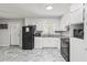 Kitchen featuring modern black appliances, granite counters and white cabinets at 271 Leafwood Ln, Riverdale, GA 30274
