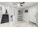 Living area with tile flooring, ceiling fan, and doors leading to other rooms at 271 Leafwood Ln, Riverdale, GA 30274