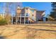 View of the back exterior, deck and large backyard that has plenty of space at 1018 Jubilee Way, Powder Springs, GA 30127