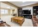 Finished basement includes cozy seating area, entertainment center, and large wooden coffee table at 1018 Jubilee Way, Powder Springs, GA 30127
