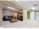 Spacious finished basement featuring a comfortable seating area with brown leather couches and neutral carpeting at 1018 Jubilee Way, Powder Springs, GA 30127
