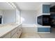 Primary bathroom with soaking tub, a fireplace, and dual vanity at 1018 Jubilee Way, Powder Springs, GA 30127