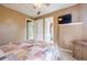 Bedroom with a colorful patchwork quilt and ensuite bathroom view at 1018 Jubilee Way, Powder Springs, GA 30127