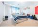 Bright, casual bedroom with a nautical theme, a bed, and a large window at 1018 Jubilee Way, Powder Springs, GA 30127