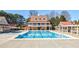 A stunning community pool with an elegant pool house and ample deck space for relaxing and socializing at 1018 Jubilee Way, Powder Springs, GA 30127