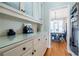 Butler's pantry and dining room with hanging shelves and a decorative table at 1018 Jubilee Way, Powder Springs, GA 30127