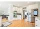 Bright kitchen with white cabinetry, stainless steel appliances, and hardwood floors at 1018 Jubilee Way, Powder Springs, GA 30127