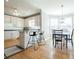 Kitchen featuring granite countertops and breakfast bar, flows into dining area at 1018 Jubilee Way, Powder Springs, GA 30127