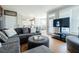 Open living room with a view of the kitchen and dining area, featuring comfortable seating at 1018 Jubilee Way, Powder Springs, GA 30127